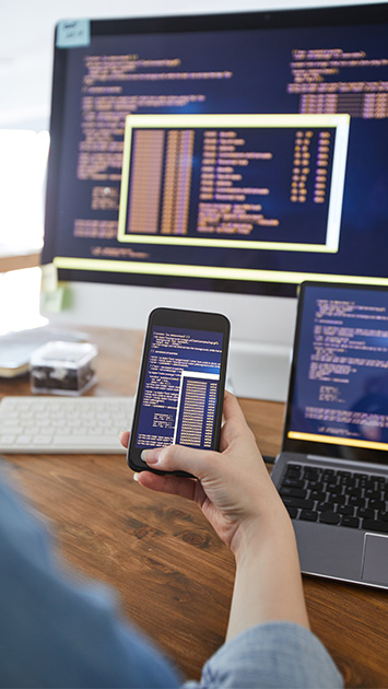 female software developer at workplace close up